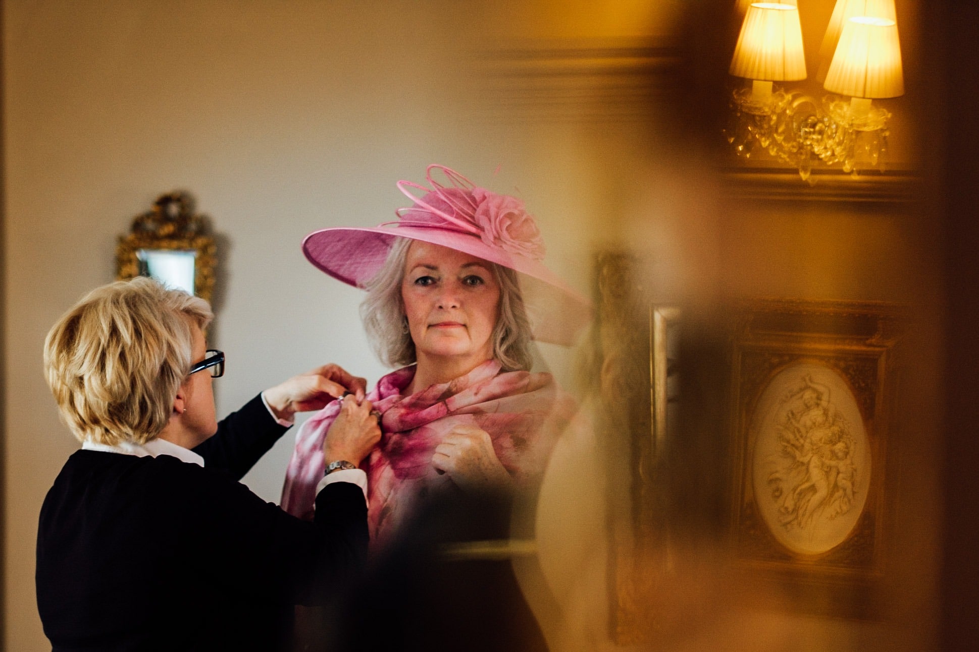 mother of the bride has her outfit adjusted at a clonabreany house wedding