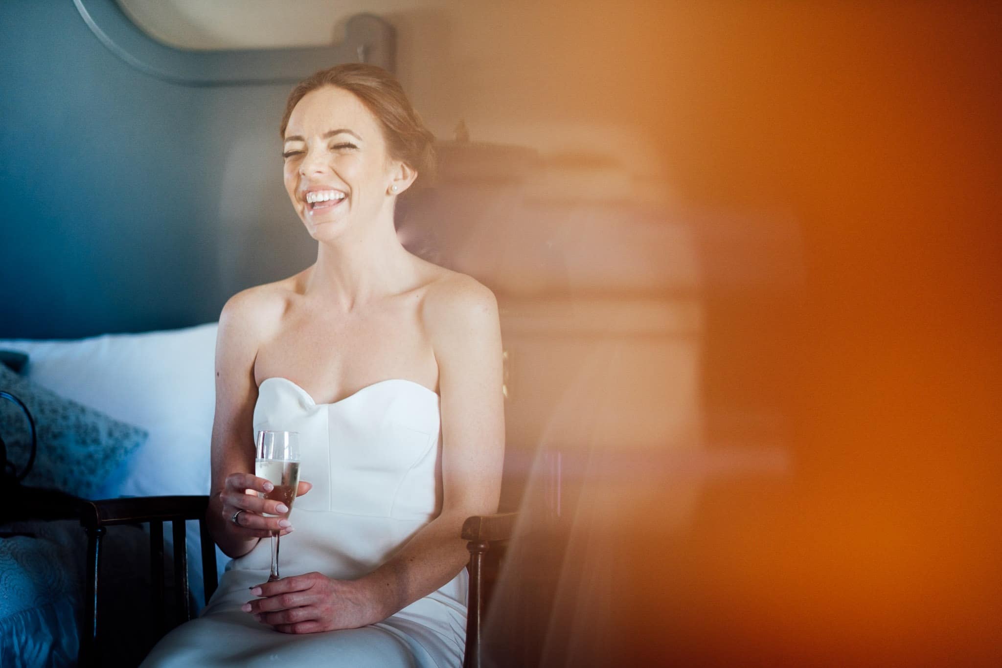 bride laughing on the morning of her wedding