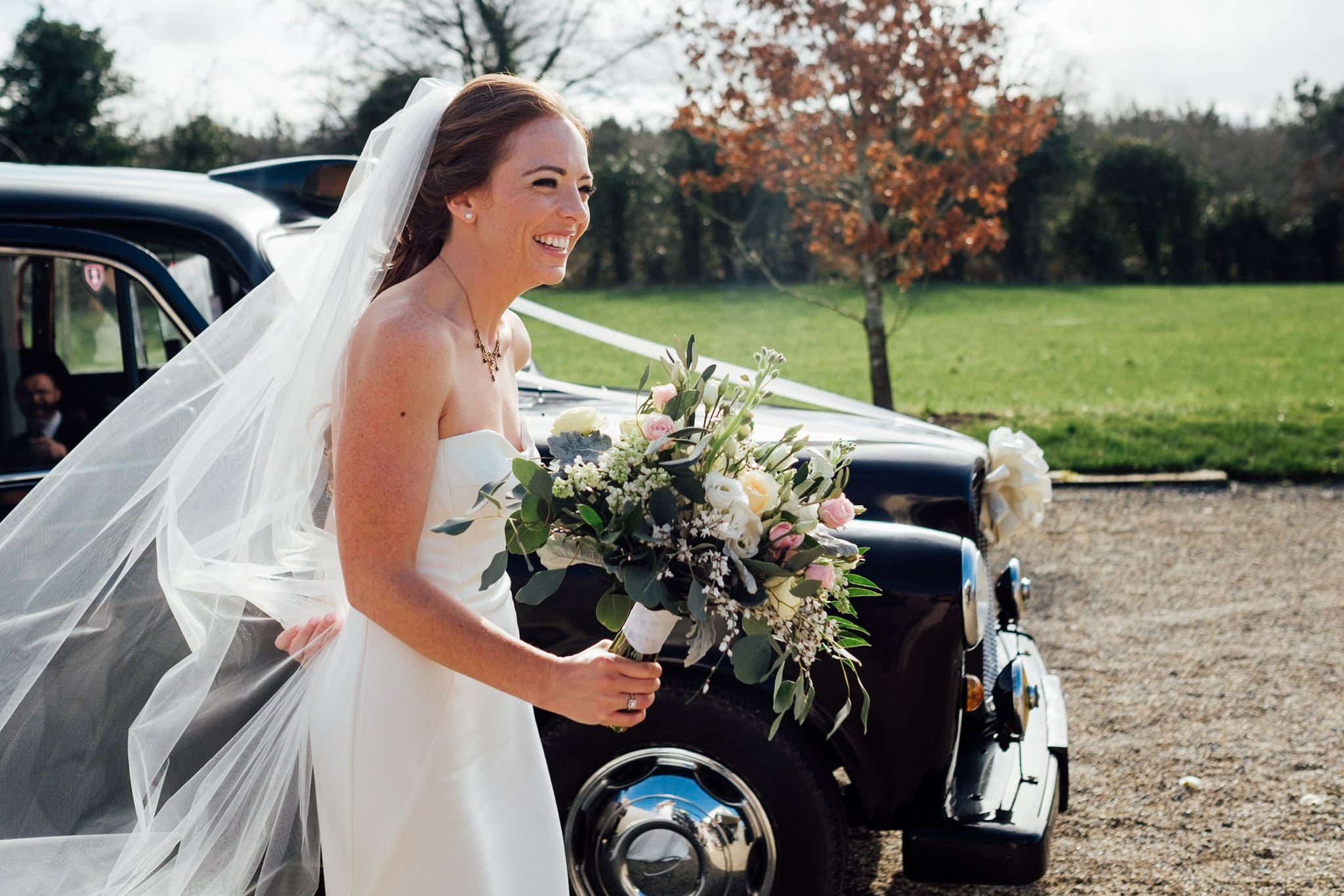 bride with bouquet walks to the ceremony room at Clonabreany house