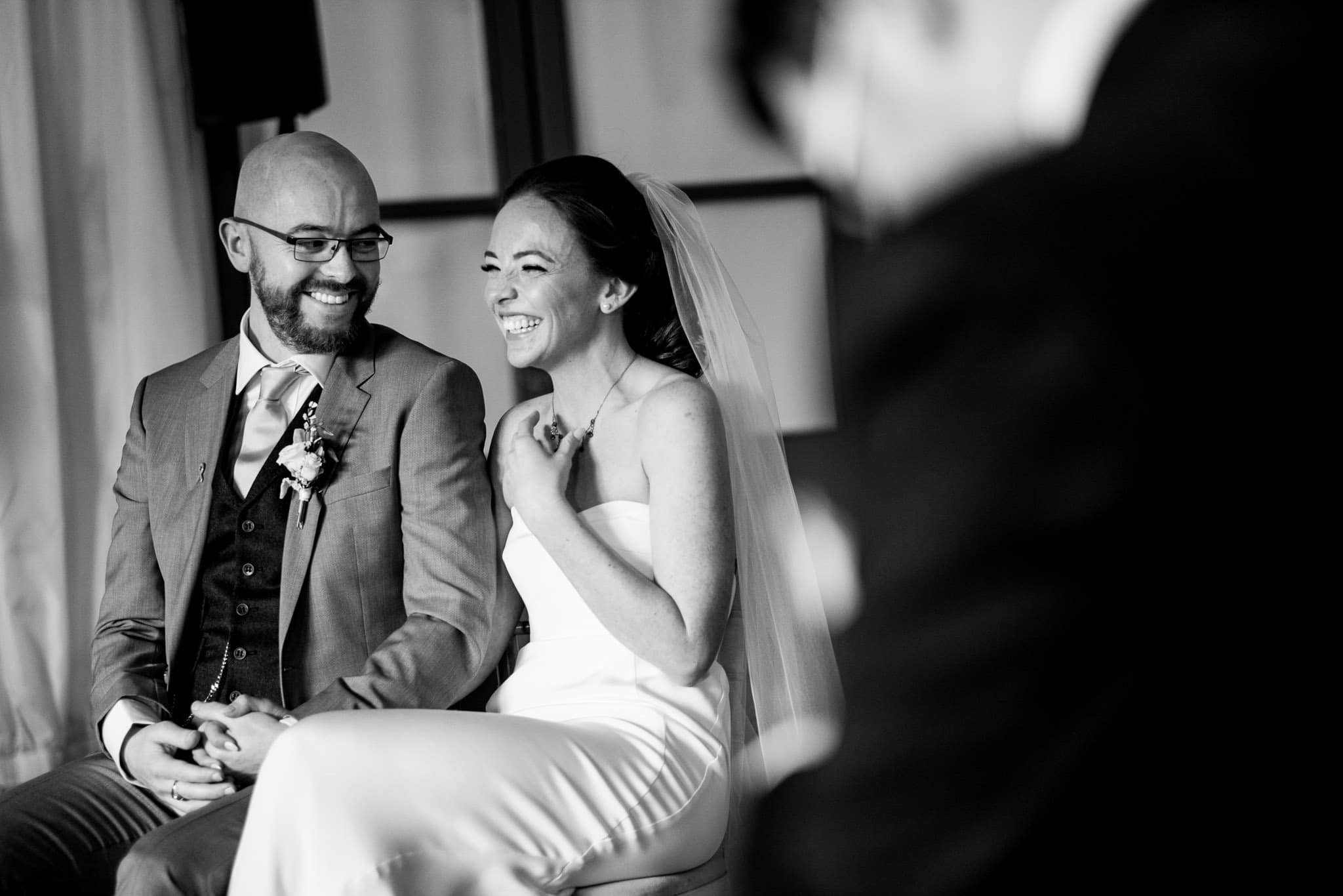 bride and groom smiling during the ceremony