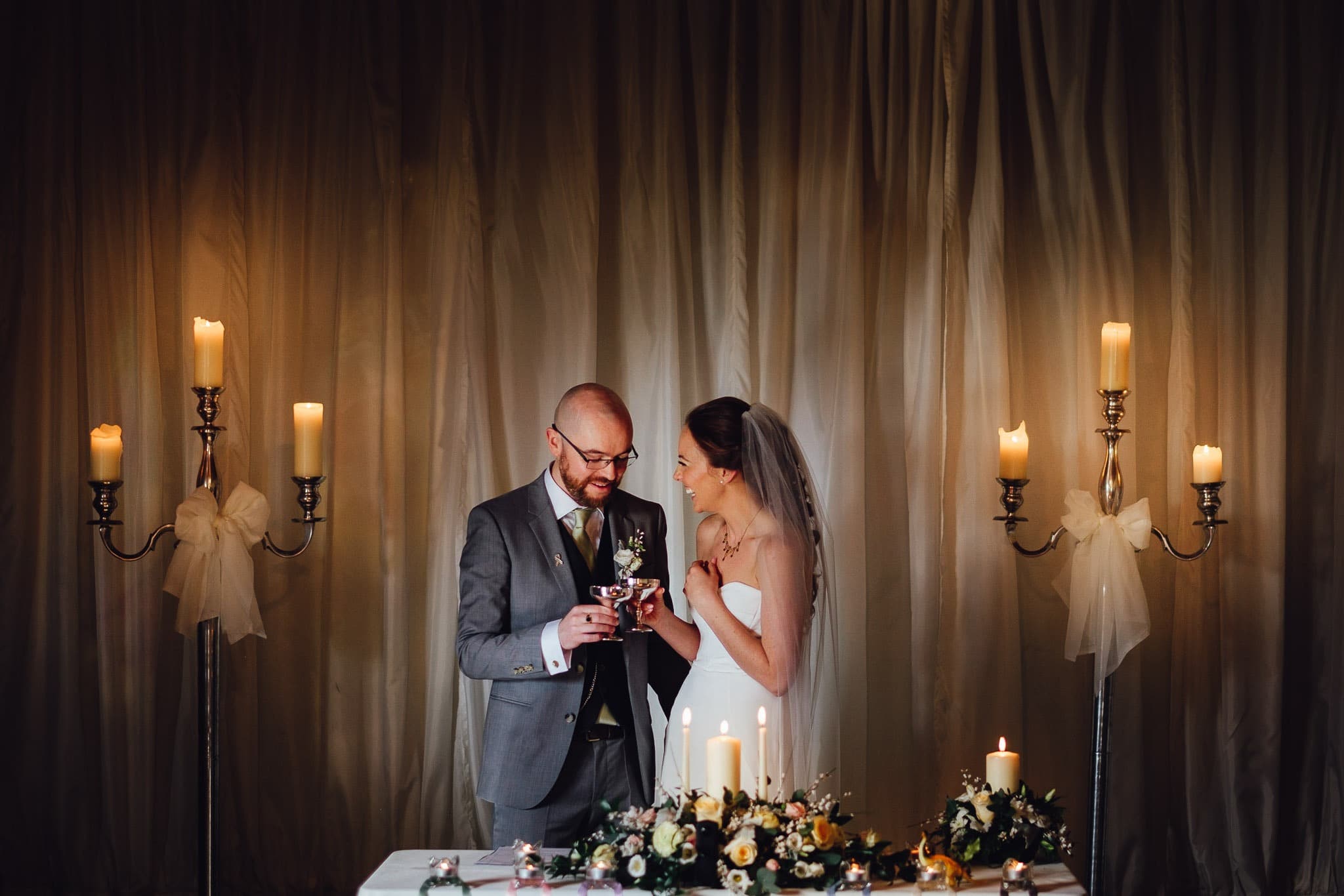 bride and groom drinking wine during the wedding ceremony