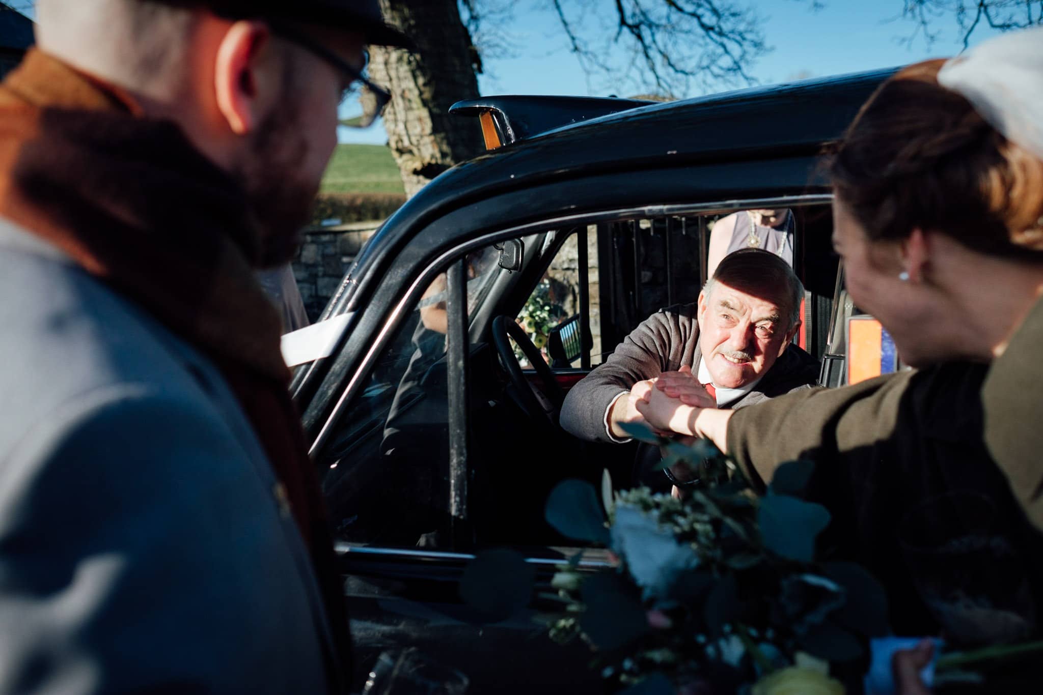 wedding guests congradulate the bride and groom