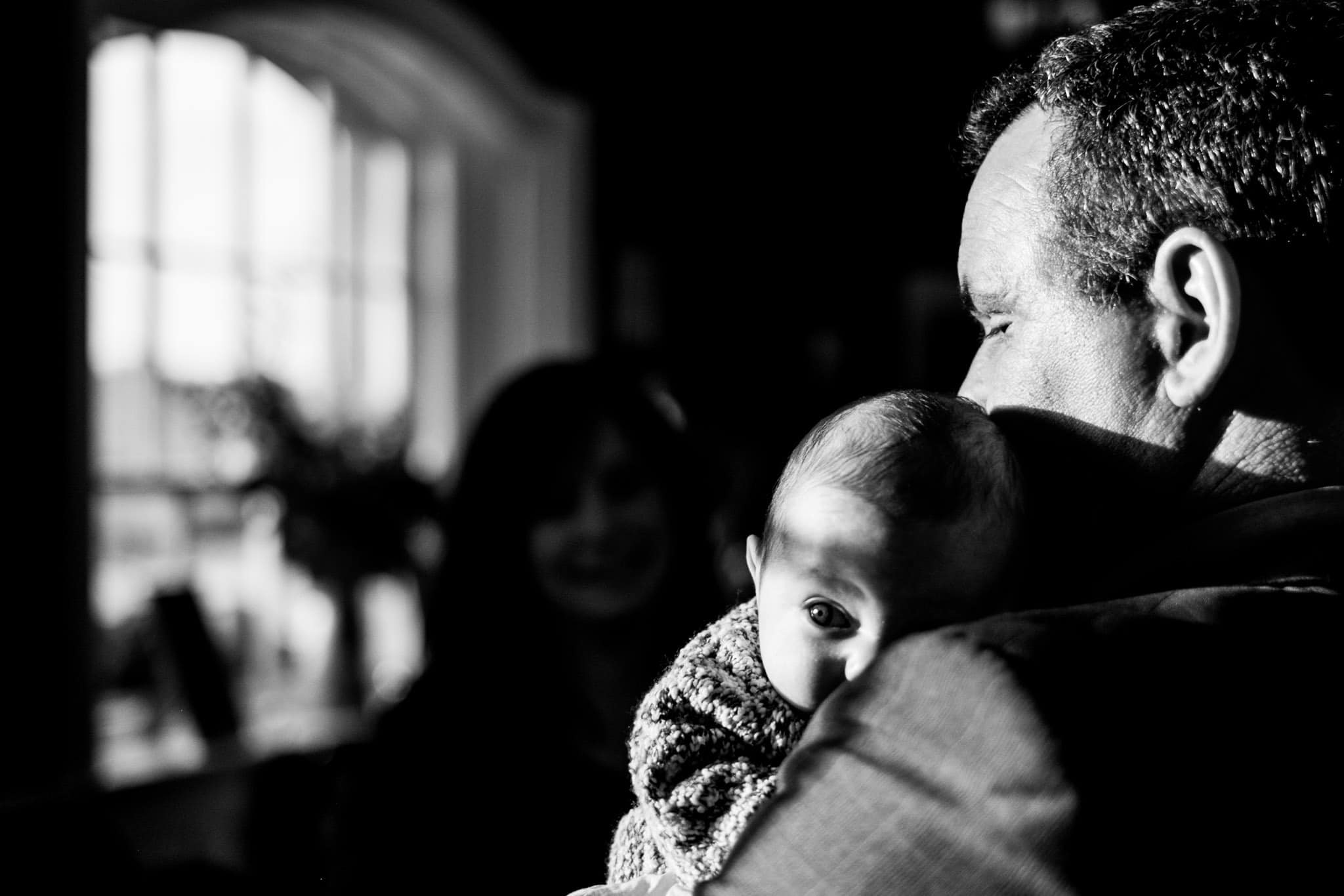 a baby being held by a guest