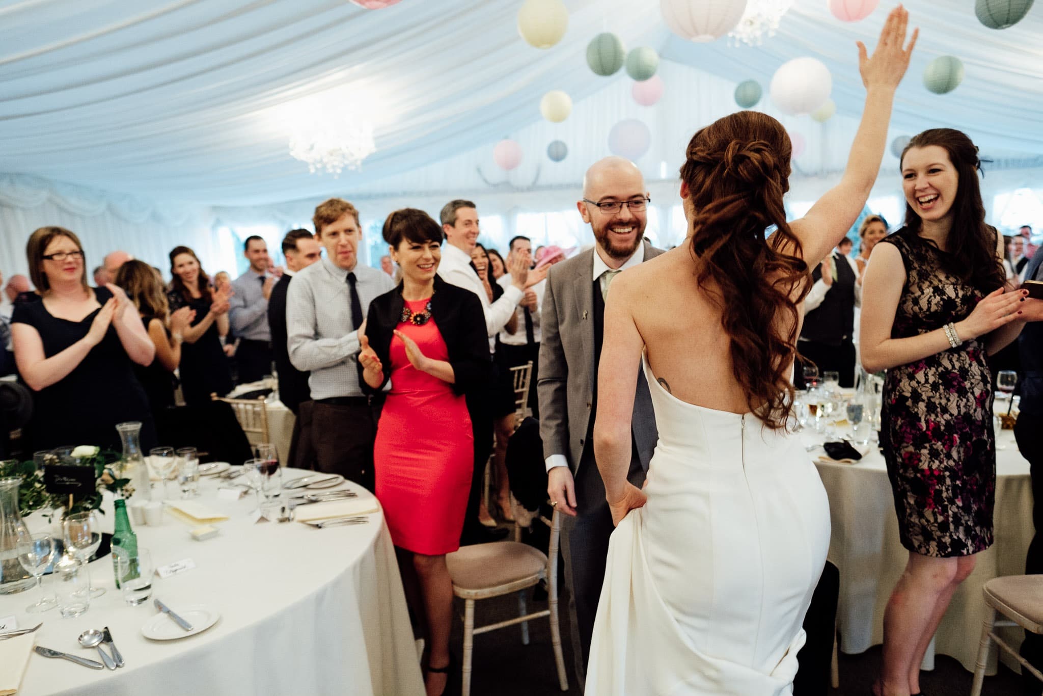 the bride and groom dancing in front of their guests