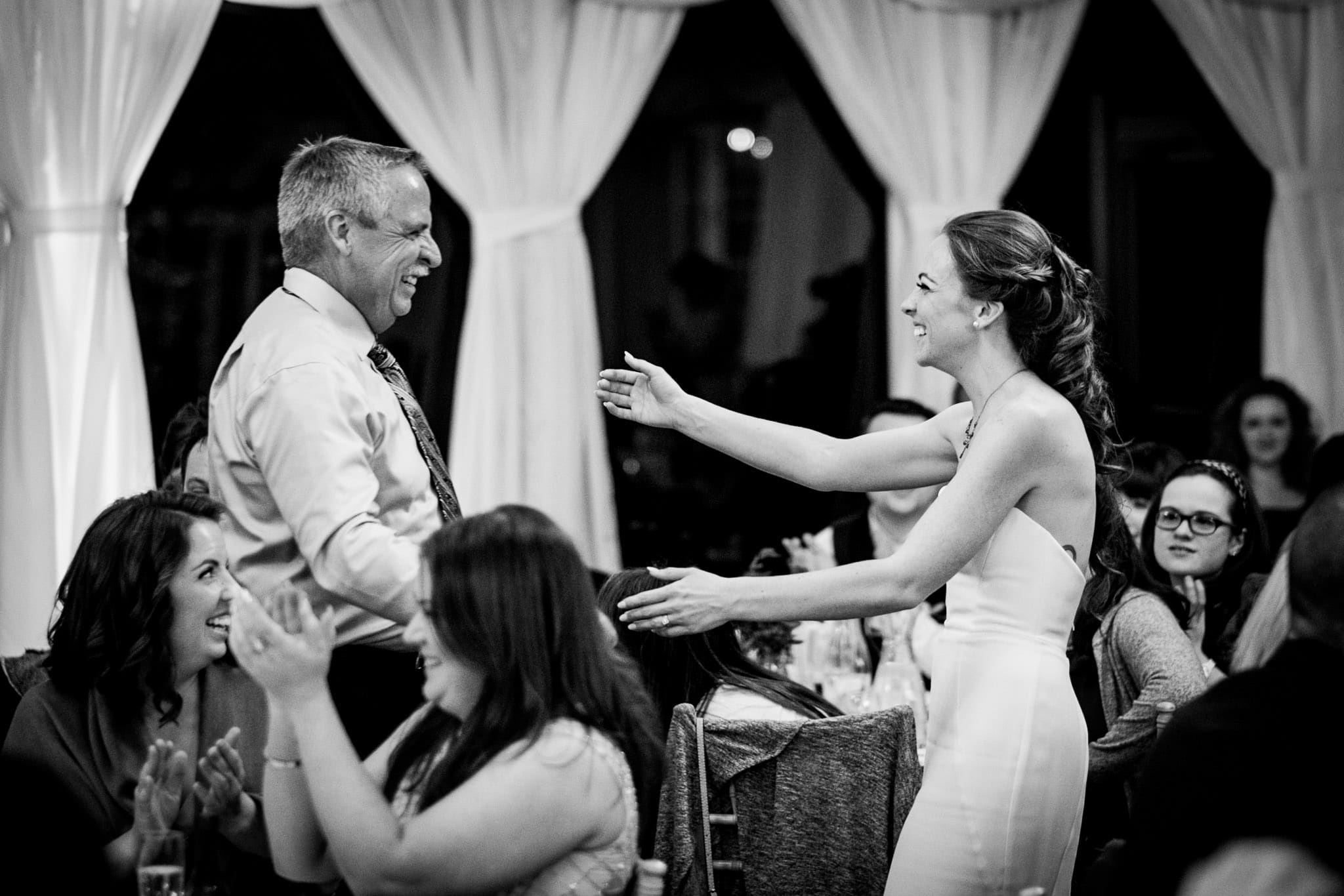 bride about to hug her father