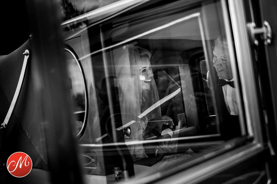 Bride arrives with her dad to the church on her wedding day