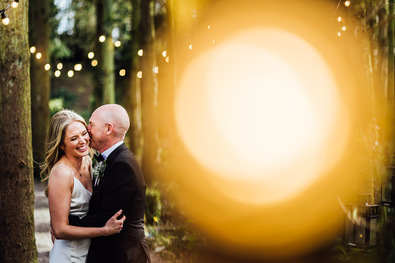 A bride and groom embrace at a Stationhouse Hotel wedding 