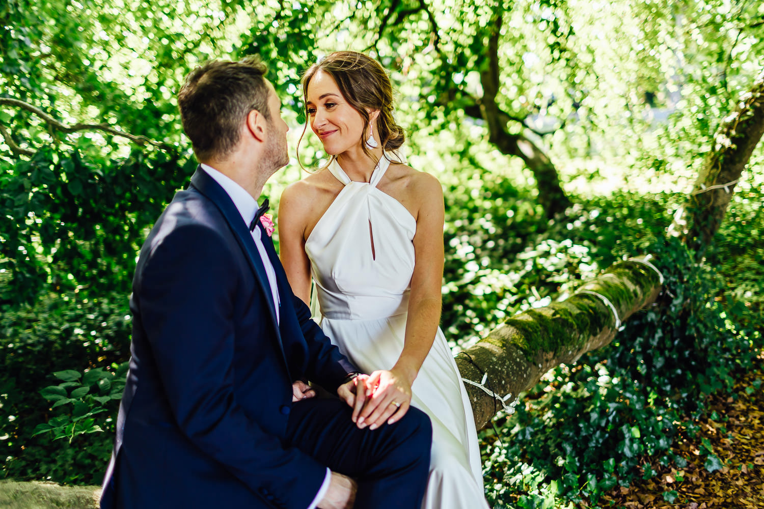 A portrait of a bride and groom under a tree on a summers day at Bellinter House