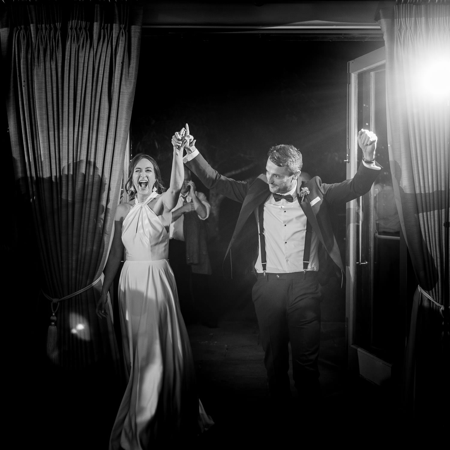 A bride and groom walk onto the dancefloor for their first dance at a Bellinter House wedding