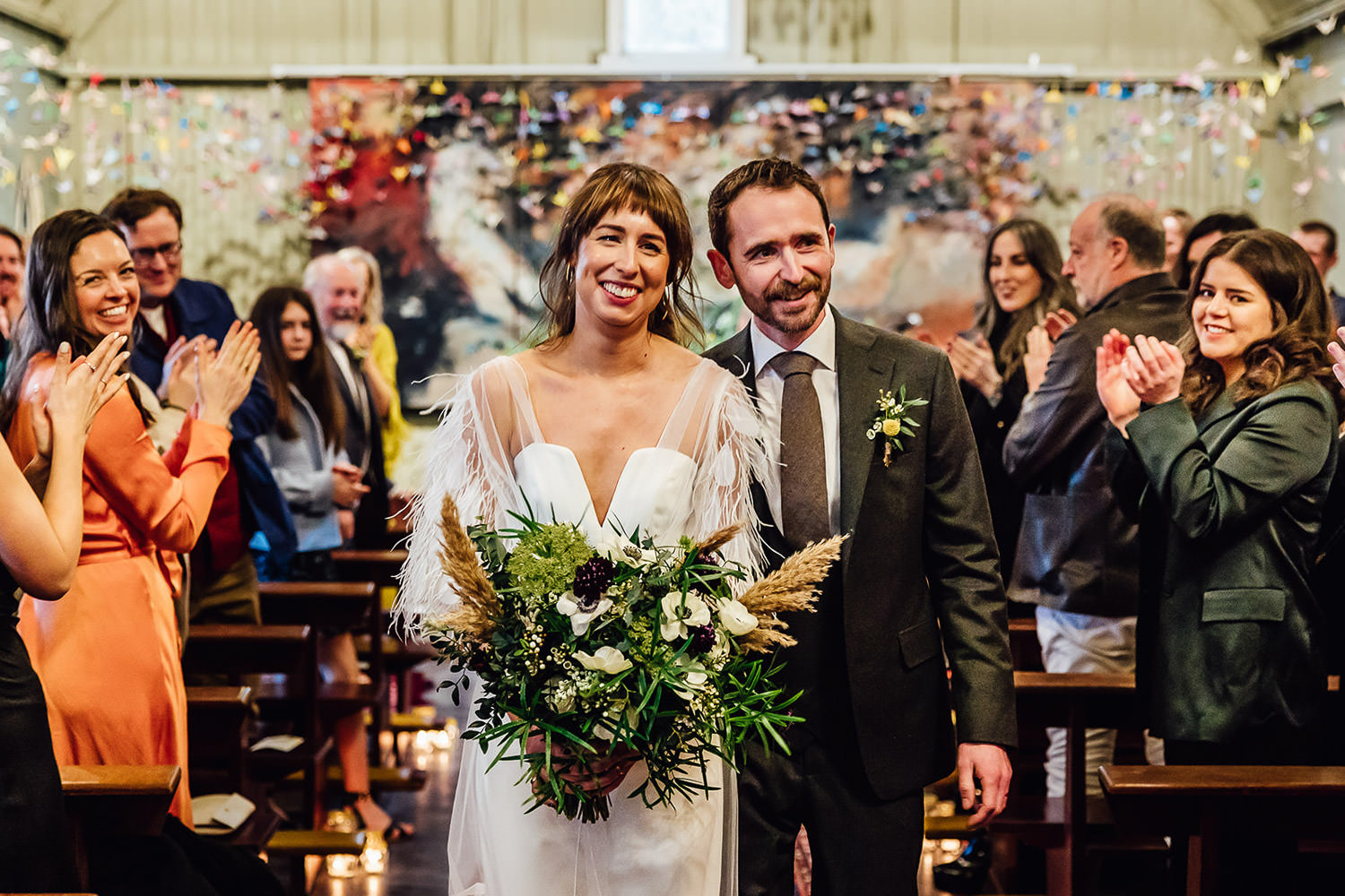 A bride and groom walking down the aisle after their wedding ceremony at Mount Druid