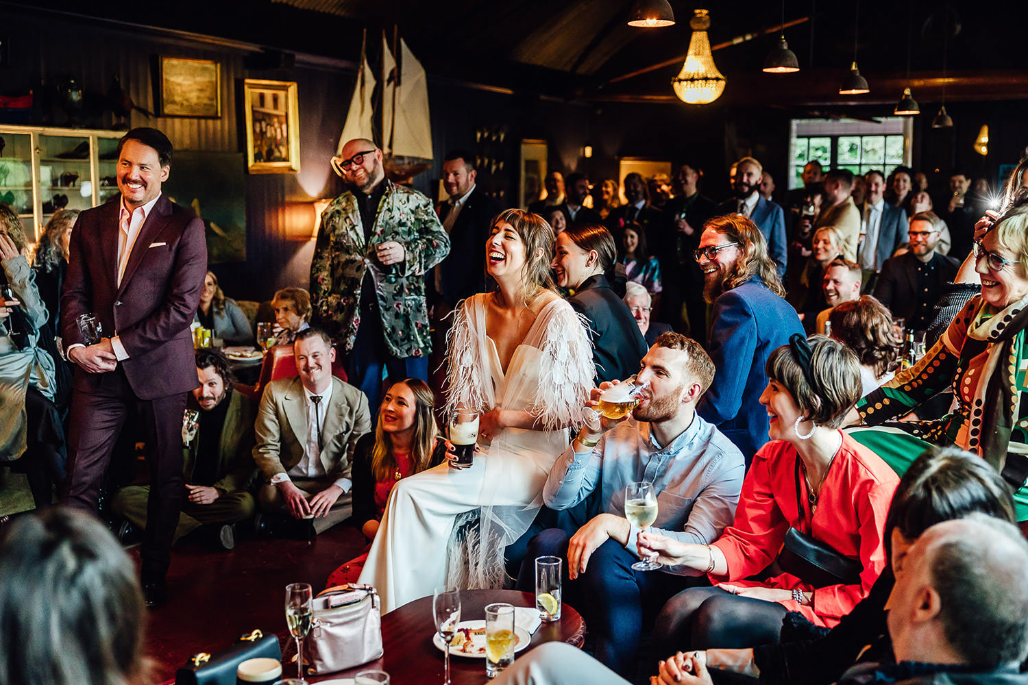 A bride laughing with her guests at a wedding reception at Mount Druid