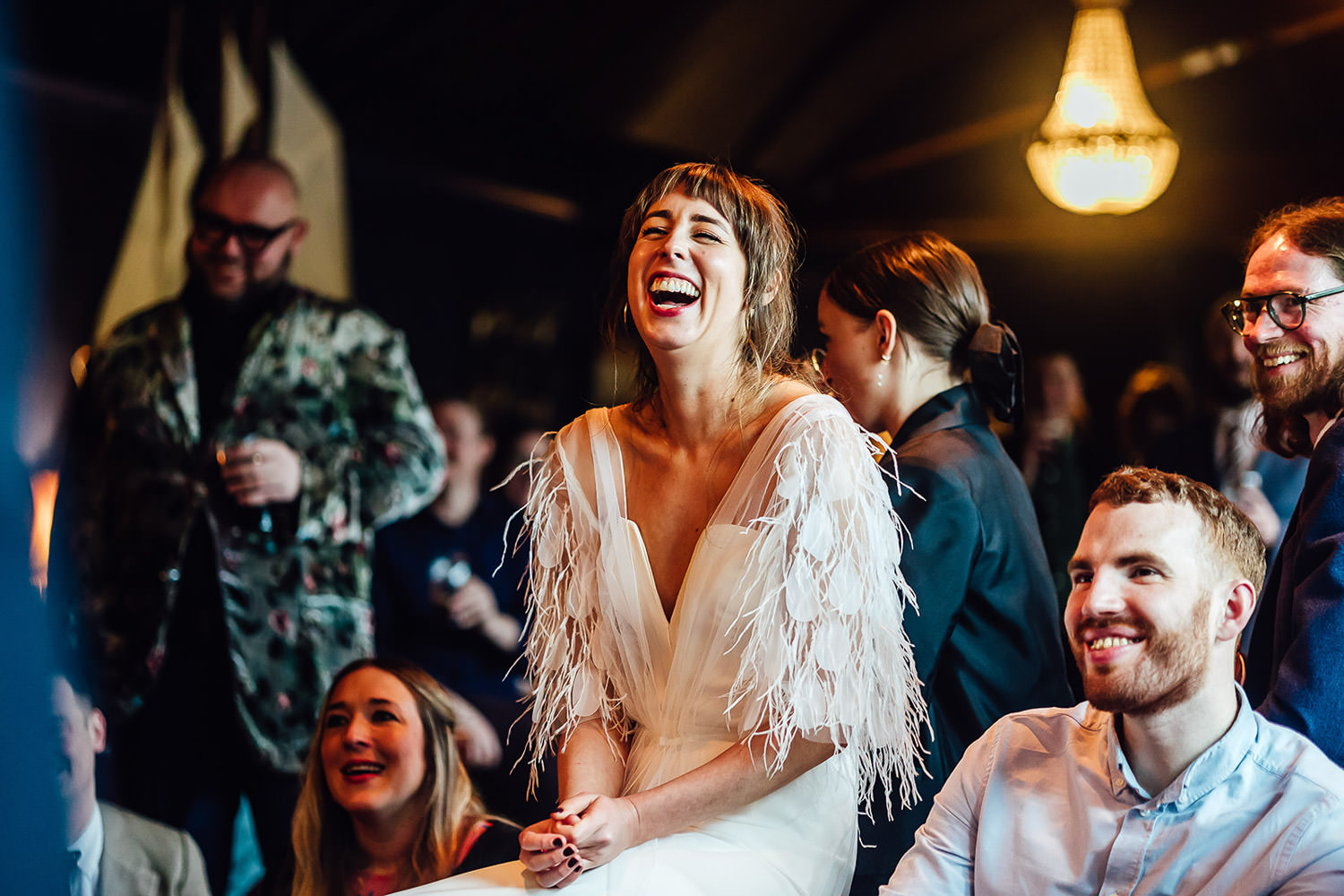 A bride laughing with her guests at a wedding reception at Mount Druid